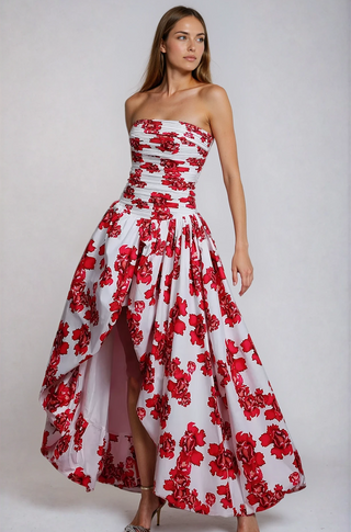 Woman wearing a strapless red floral bubble hem dress from shopUNIQUES