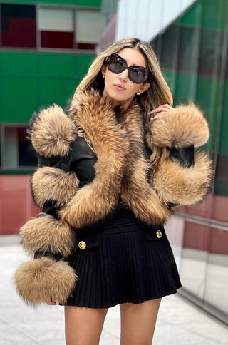 Model wearing matte black lamb leather crop jacket with raccoon fur trim from shopUNIQUES