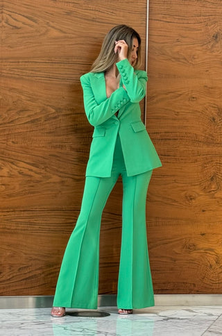 Model wearing green Adele blazer and pants set from shopUNIQUES – tailored women's pantsuit for work or graduation