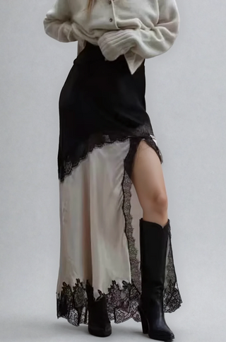 Model wearing Camila lace trim asymmetrical maxi skirt in black and ivory – shopUNIQUES