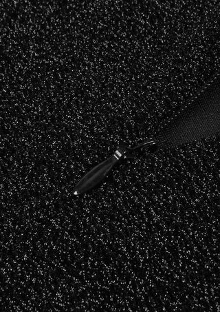 Close-up of black floral mesh hem on Midnight Bloom glitter mermaid gown