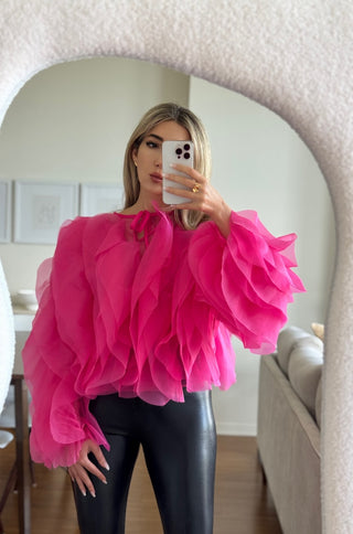 Ladan wearing sheer ruffle mesh blouse – Rose top from shopUNIQUES in hot pink