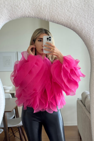 Model wearing sheer ruffle mesh blouse – Rose top from shopUNIQUES in hot pink