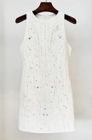 A white A-line mini dress with crystal and pearl embroidery, featuring a racer neck and a hidden back zipper.
